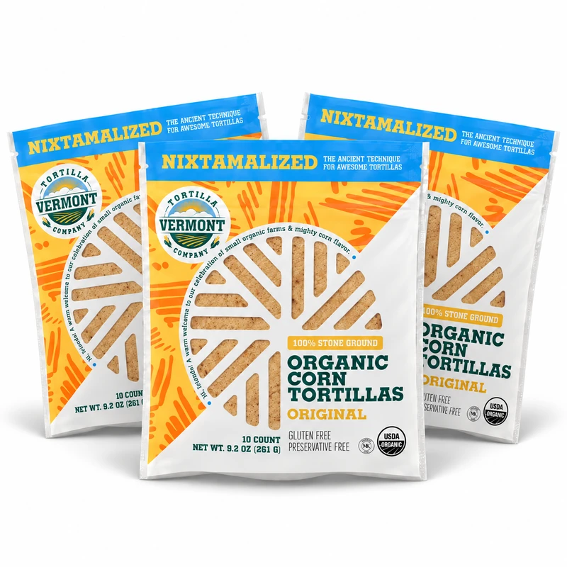 Three 10-count packs of Vermont Tortilla Company 6-inch Original organic corn tortillas arranged together on white