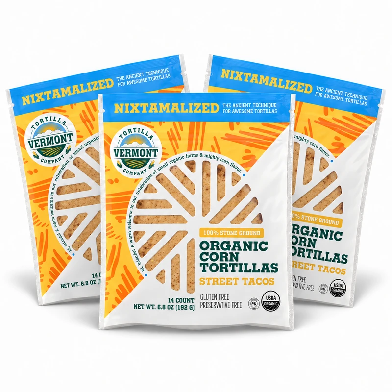 Three 14-count packs of Vermont Tortilla Company 4-inch Street Taco organic corn tortillas arranged together on white