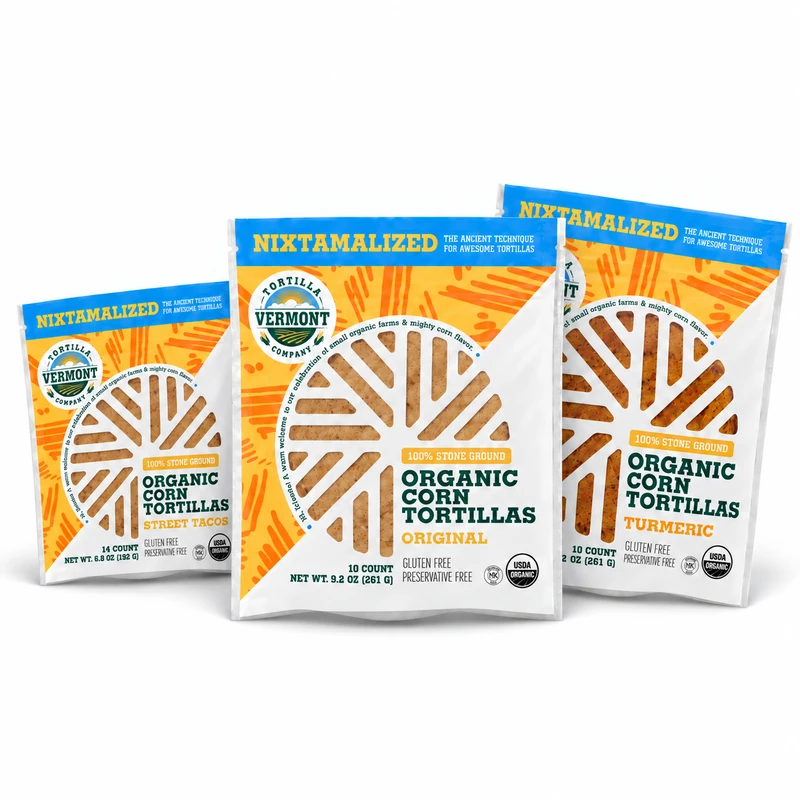 Three tortilla packs together on white: one smaller Street Taco on the left, one Original in front, and one Turmeric on the right