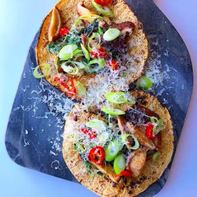 Corn tortillas filled with sautéed mushrooms and kale, grated Manchego, sliced scallions and red pickled pepper pieces