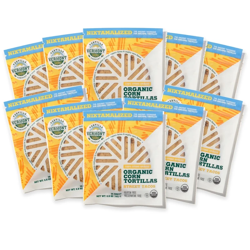 Ten packs of Street Taco 4-inch organic corn tortillas arranged in an overlapping fan