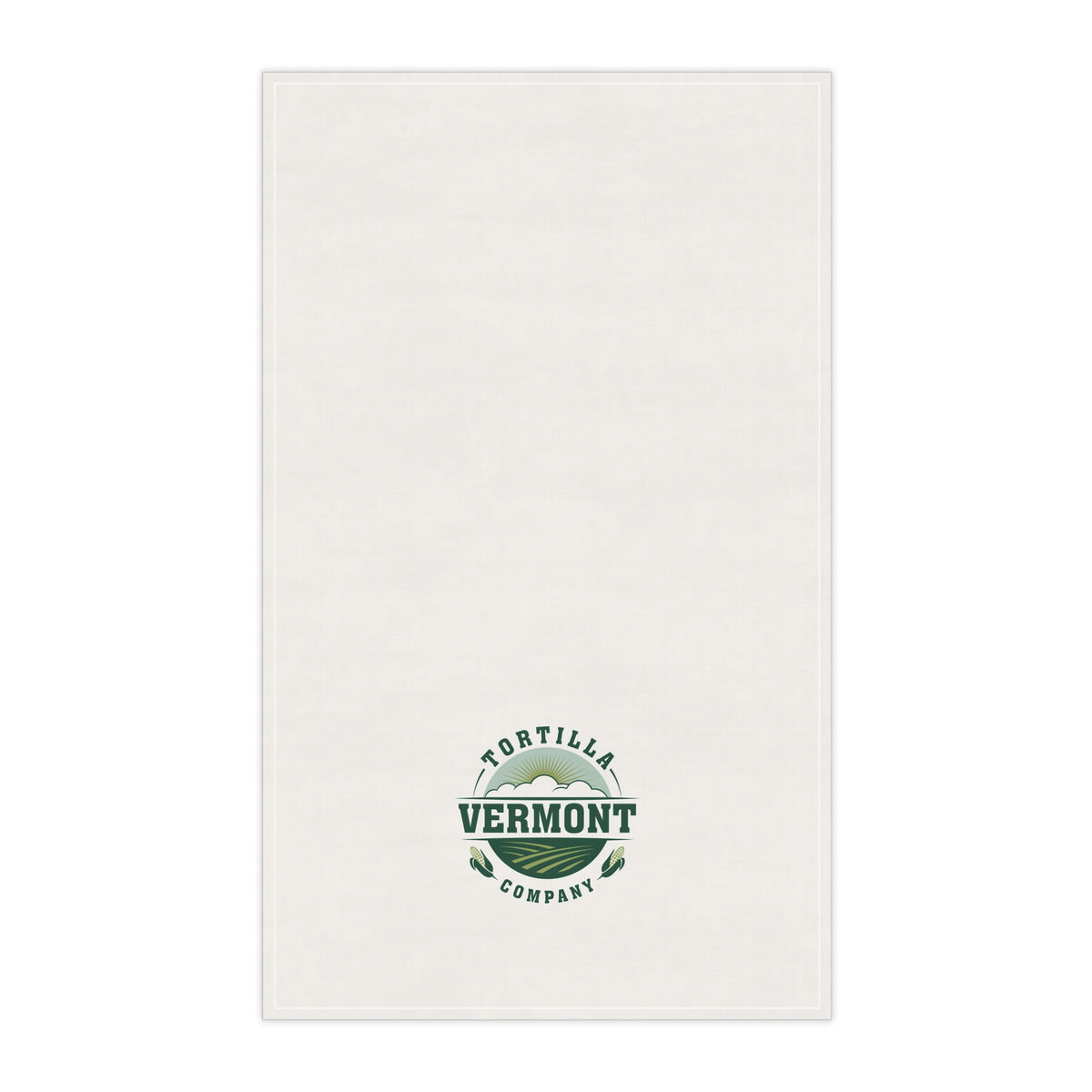 Classic Emblem white cotton twill tortilla towel, front view with the green-and-sage Vermont Tortilla Company emblem toward the lower end