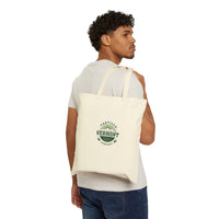 Classic Emblem natural canvas tote, carried over the shoulder, viewed from behind