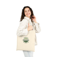 Classic Emblem natural canvas tote, worn on the shoulder, viewed from the front