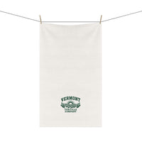 Fields & Sun white cotton twill tortilla towel hanging from a line, showing the forest-green design