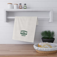 Fields & Sun white cotton twill tortilla towel folded over a rail with the forest-green design visible