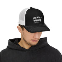 Black / White Fields & Sun Richardson 112 trucker hat worn by a model, front view showing the white embroidery and curved visor