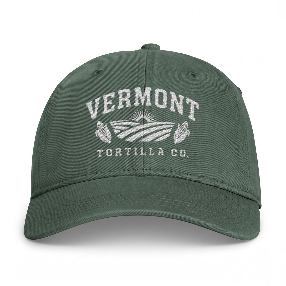 Moss Fields & Sun Comfort Colors washed-cotton cap with white VERMONT lettering, rising sun, farm fields, two ears of corn, and TORTILLA CO. embroidered on the front, front view