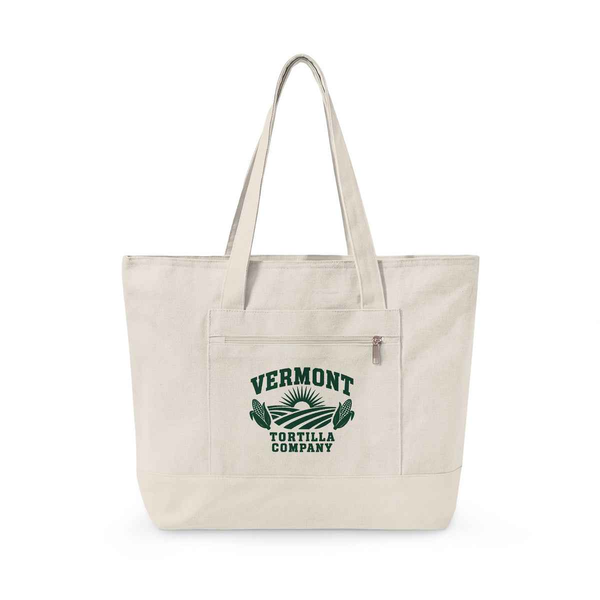 Natural Fields & Sun zippered canvas tote with the Vermont Tortilla Company fields, rising sun, and two ears of corn in forest green on the front pocket, with matching natural handles and base, front view
