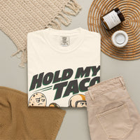 Ivory Hold My Taco T-shirt, folded shirt styled with casual clothing and accessories