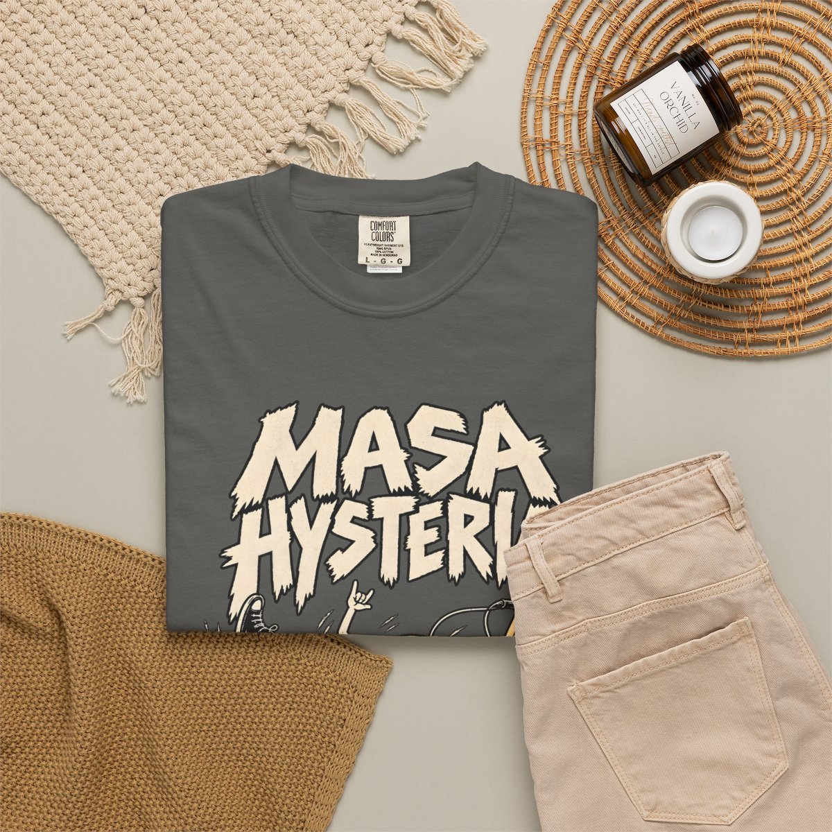 Pepper Masa Hysteria T-shirt, folded shirt styled with casual clothing and accessories
