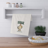 Tastes Like Corn white cotton twill tortilla towel folded over a rail with the chicken artwork and lettering visible