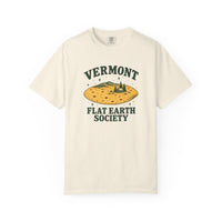 Ivory Vermont Flat Earth Society T-shirt, front with Vermont Flat Earth Society lettering around a golden tortilla landscape with mountains, evergreens, and a cabin