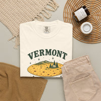 Ivory Vermont Flat Earth Society T-shirt, folded shirt with its tortilla landscape print, styled with casual clothing and accessories